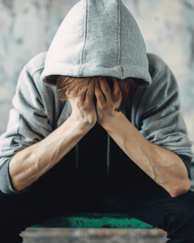 Man holding his face in his hands